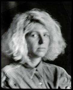 Long-exposure 4×5 portrait exploring layered identity, blurred presence and shifting self. From the series ‘Odrazi’ by Balša Gobović.