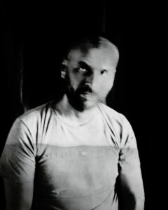 Long-exposure 4×5 portrait exploring layered identity, blurred presence and shifting self. From the series ‘Odrazi’ by Balša Gobović.