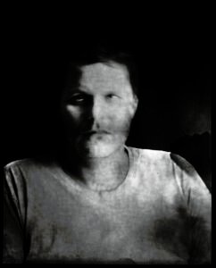 Long-exposure 4×5 portrait exploring layered identity, blurred presence and shifting self. From the series ‘Odrazi’ by Balša Gobović.