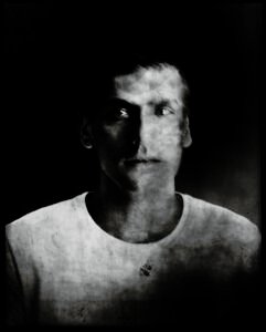 Long-exposure 4×5 portrait exploring layered identity, blurred presence and shifting self. From the series ‘Odrazi’ by Balša Gobović.