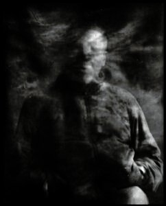 Long-exposure 4×5 portrait exploring layered identity, blurred presence and shifting self. From the series ‘Odrazi’ by Balša Gobović.