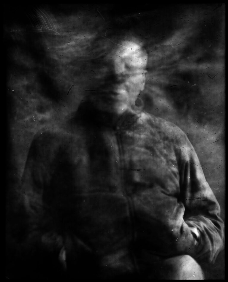Long-exposure 4×5 portrait exploring layered identity, blurred presence and shifting self. From the series ‘Odrazi’ by Balša Gobović.