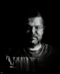 Long-exposure 4×5 portrait exploring layered identity, blurred presence and shifting self. From the series ‘Odrazi’ by Balša Gobović.