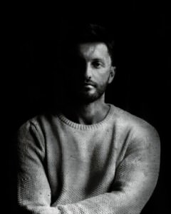 Long-exposure 4×5 portrait exploring layered identity, blurred presence and shifting self. From the series ‘Odrazi’ by Balša Gobović.